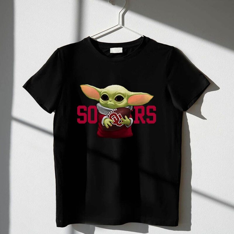 Baby Yoda Holding Football with Oklahoma Sooners 1 T Shirt.jpg