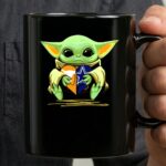 Baby Yoda Holding Texas Longhorns And Dallas Cowboys Heart 3 mug.jpg