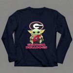 Georgia Bulldogs Baby Yoda Holding Football 9 Long Sleeves.jpg